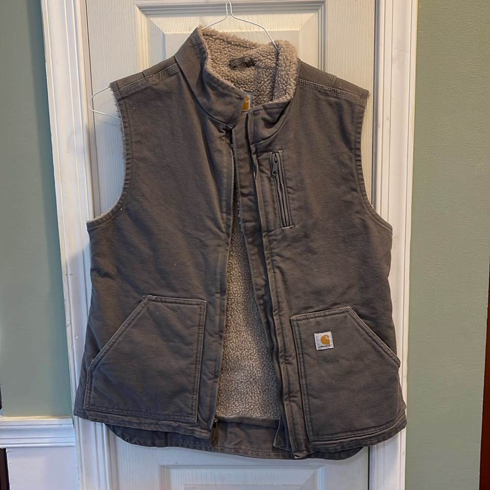 Carhartt, gray vest, fleece lined size small. Worn one time, excellent condition